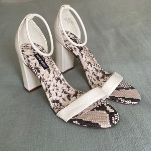 White size 8 women’s heeled sandals